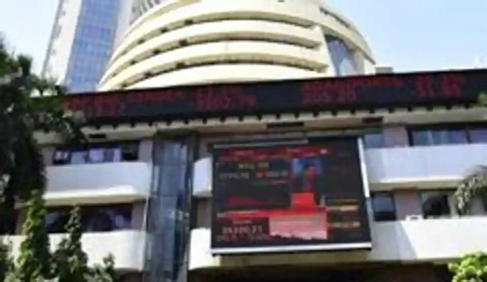 People walk by screen installed in BSE in Mumbai, India, on Monday, March 23, 2020.