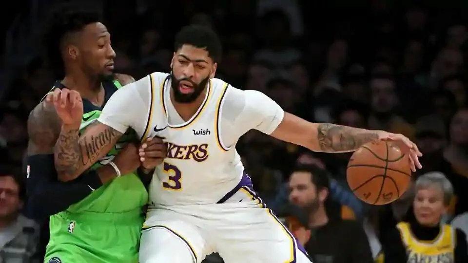 Minnesota Timberwolves forward Robert Covington (33) guards Los Angeles Lakers forward Anthony Davis (3) as he moves to the basket in the first half of the game at Staples Center.